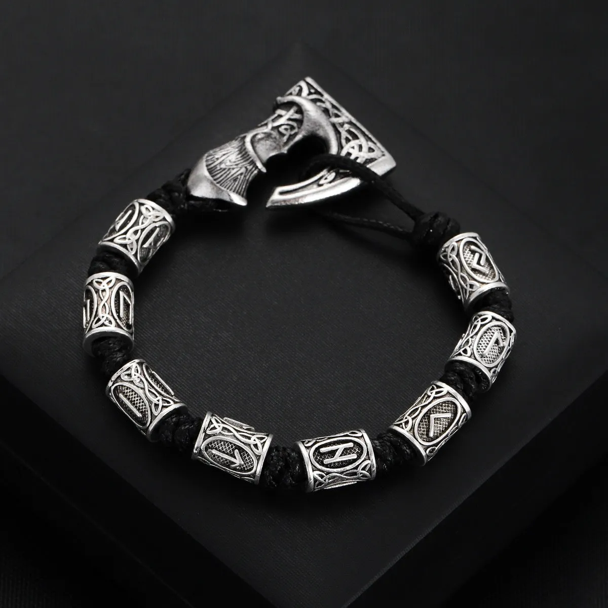 Handmade alloy rune lettering spacer beads woven bracelet on surface, three colour options available