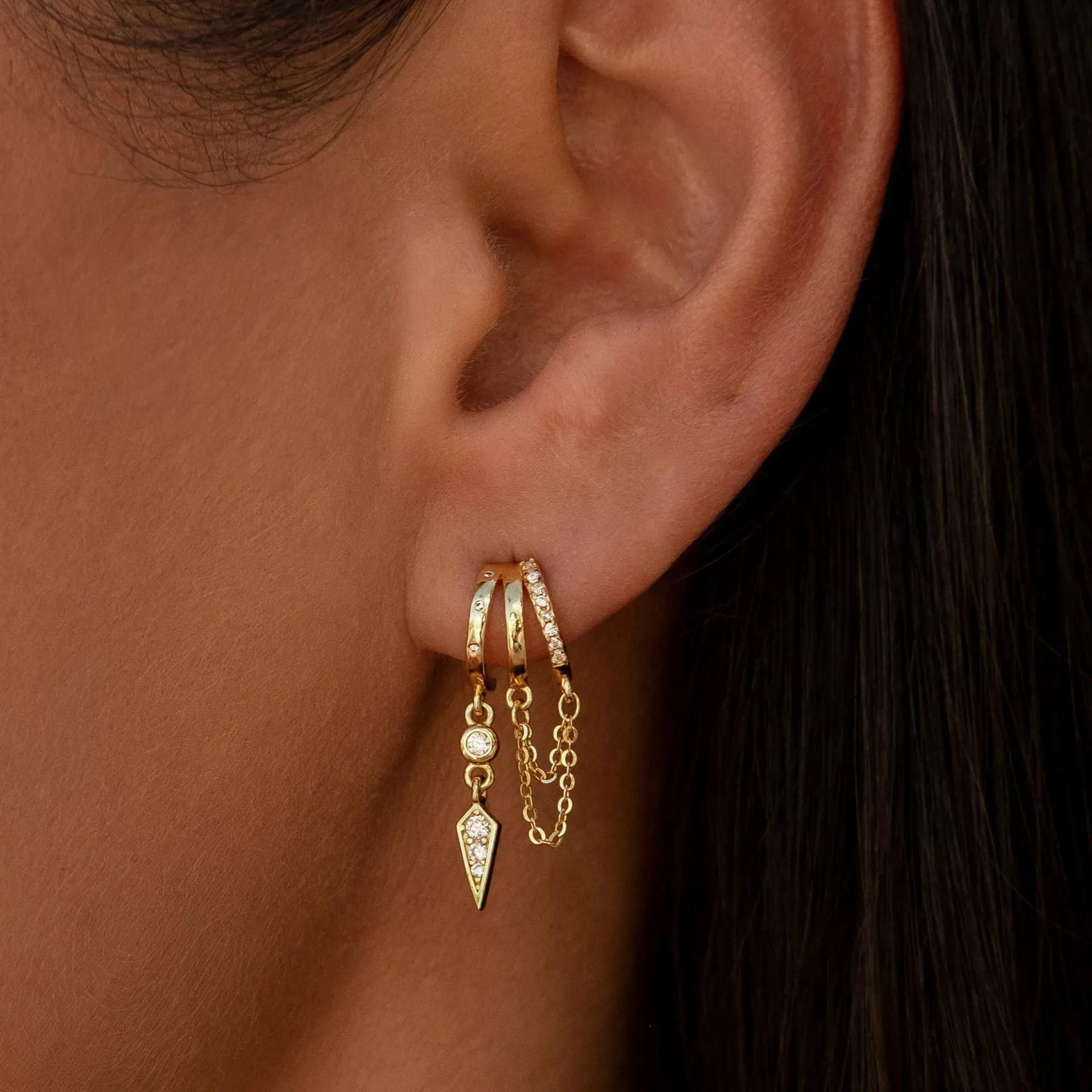 Brass gold plated chain tassel earring with copper base, one colour option shown against a neutral background.