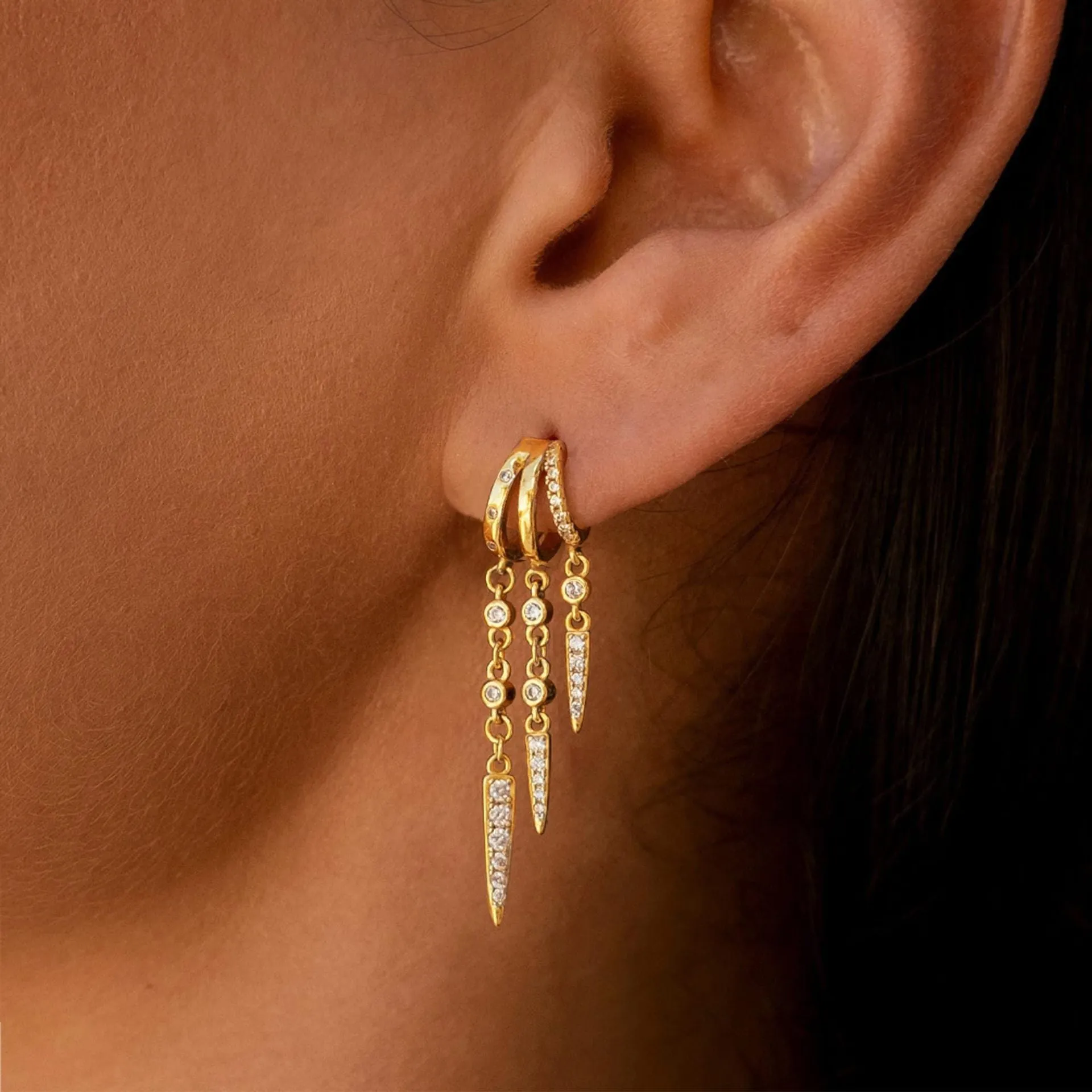 Brass gold plated chain tassel earring with copper base, one colour option shown against a neutral background.