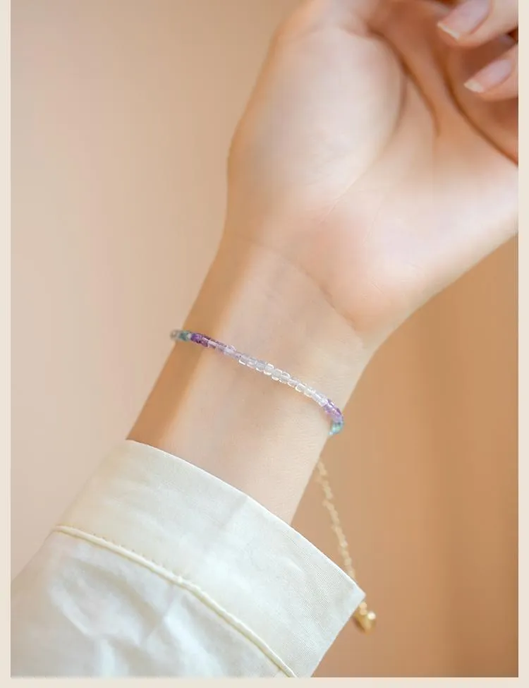 Handmade women's rainbow fluorite bracelet with copper and geometric quadrilateral shape