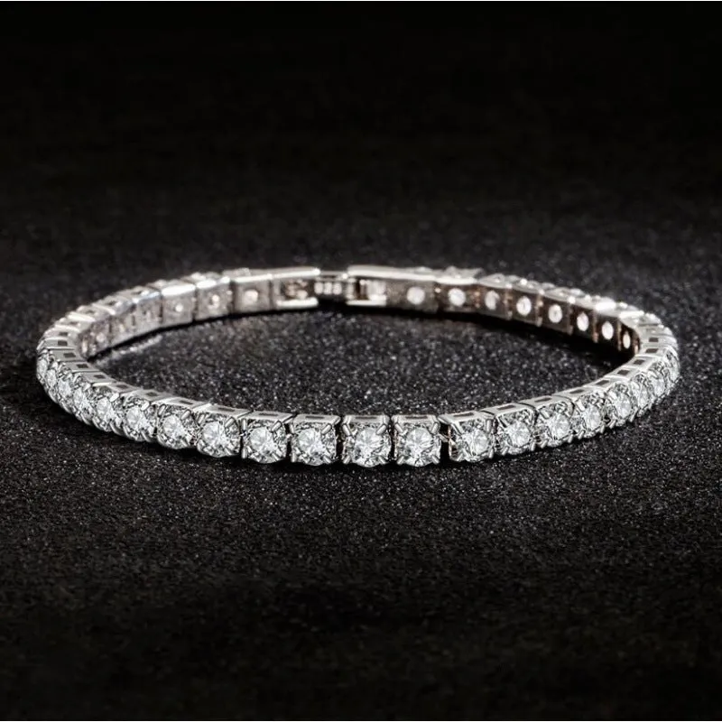 Women's simple diamond studded bracelet in gold finish with 4mm band width on white background
