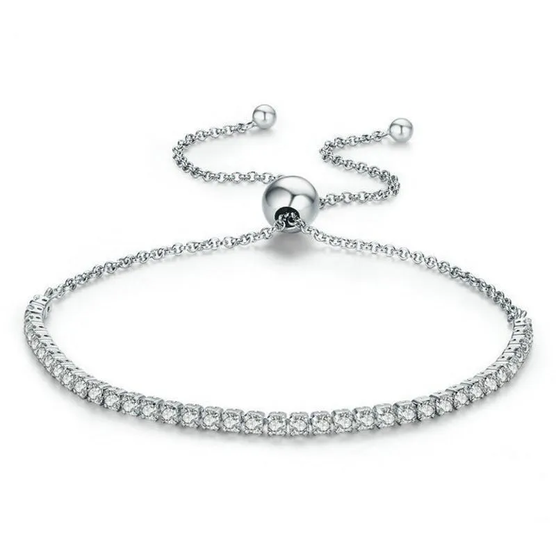 Women's simple diamond studded bracelet in gold finish with 4mm band width on white background