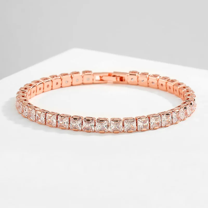 Women's simple diamond studded bracelet in gold finish with 4mm band width on white background