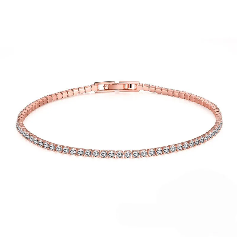 Women's simple diamond studded bracelet in gold finish with 4mm band width on white background