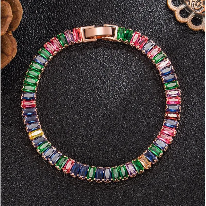 Women's simple diamond studded bracelet in gold finish with 4mm band width on white background