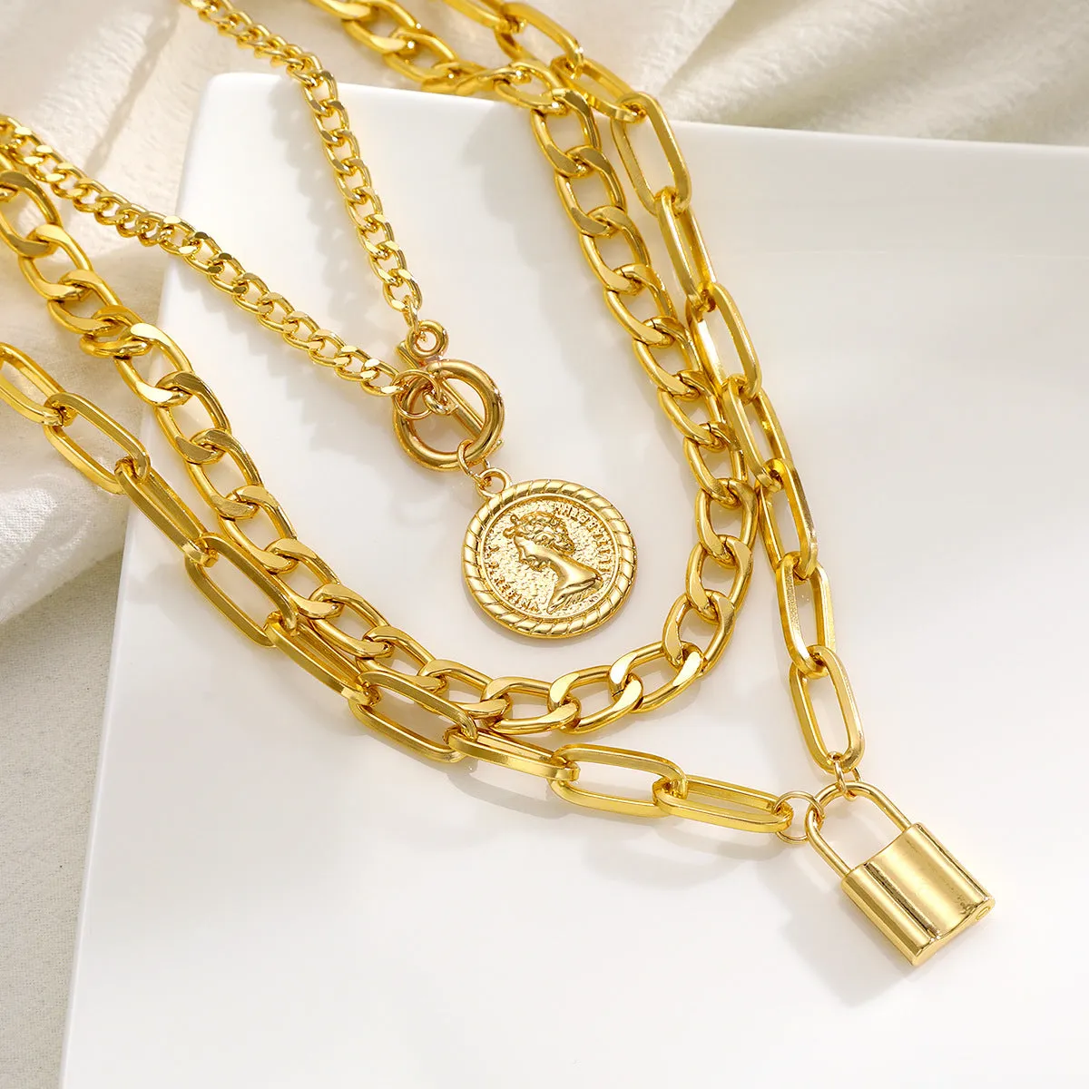 Women's light luxury geometric zinc alloy necklace set with electroplated finish, three colour options