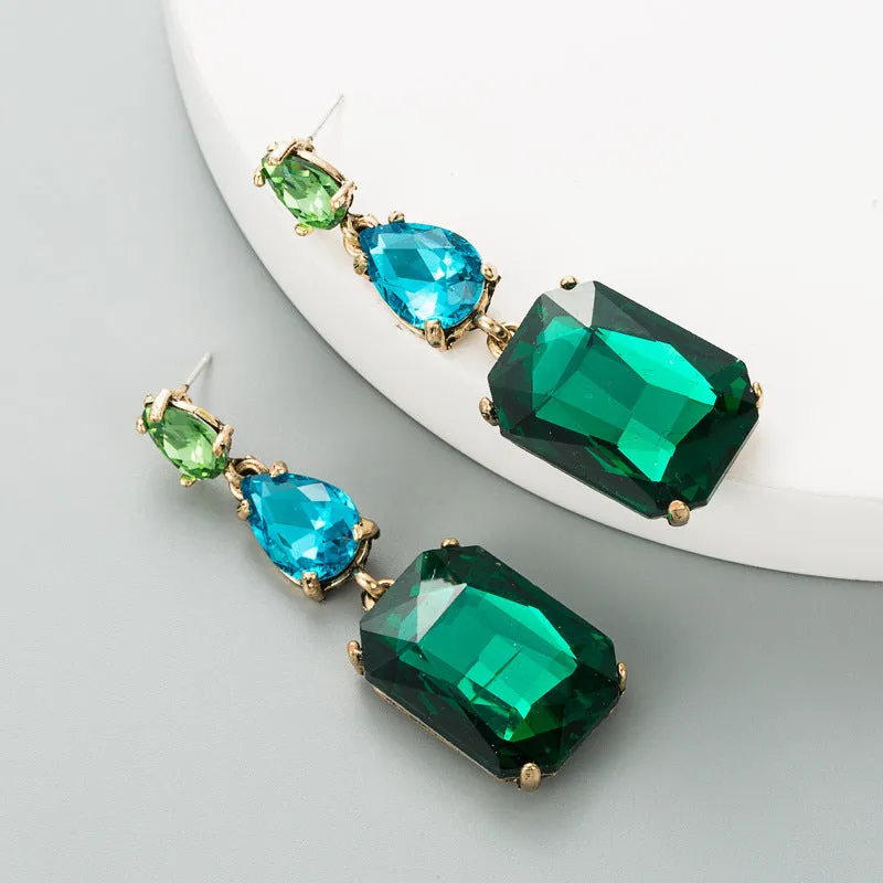 Pair of minimalist rhinestone geometric earrings in round shape, available in purple, green, or brown, European American fashion style.
