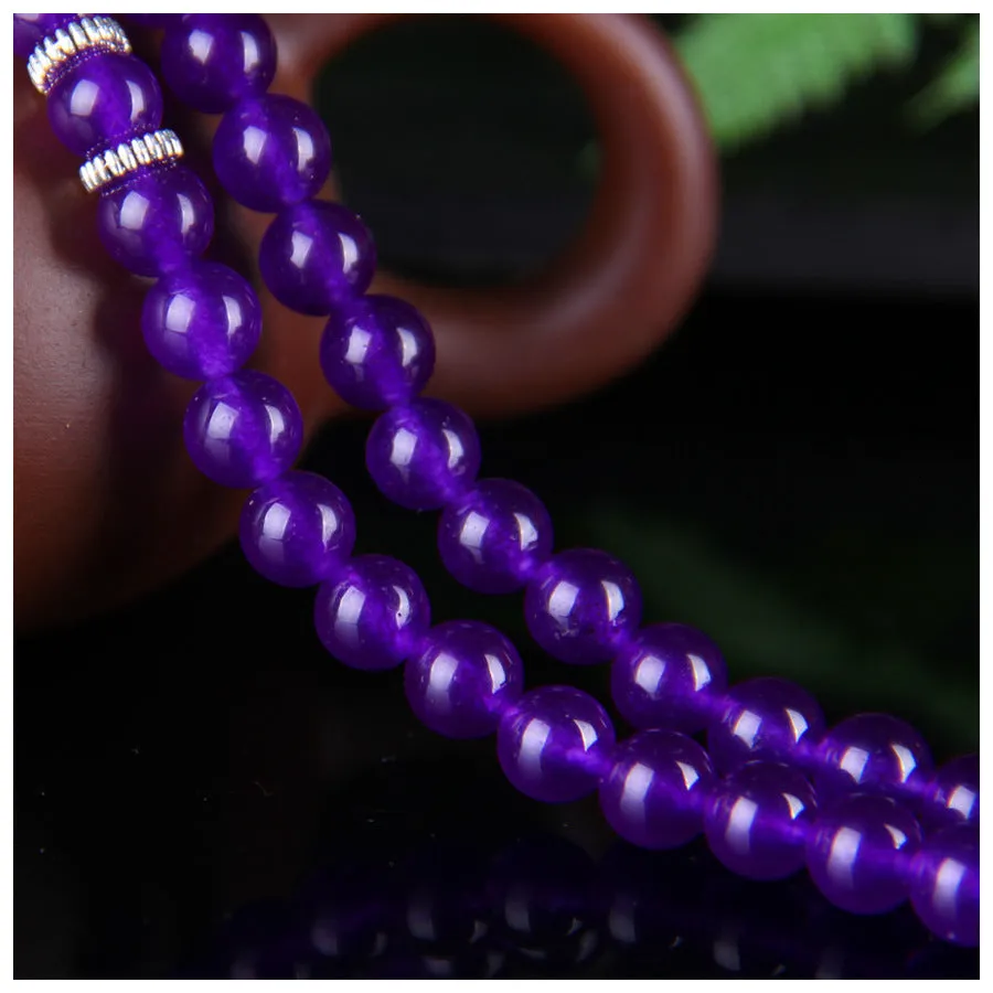 Purple ethnic-style women's bracelet with three circles of polished chalcedony beads on an adjustable band.