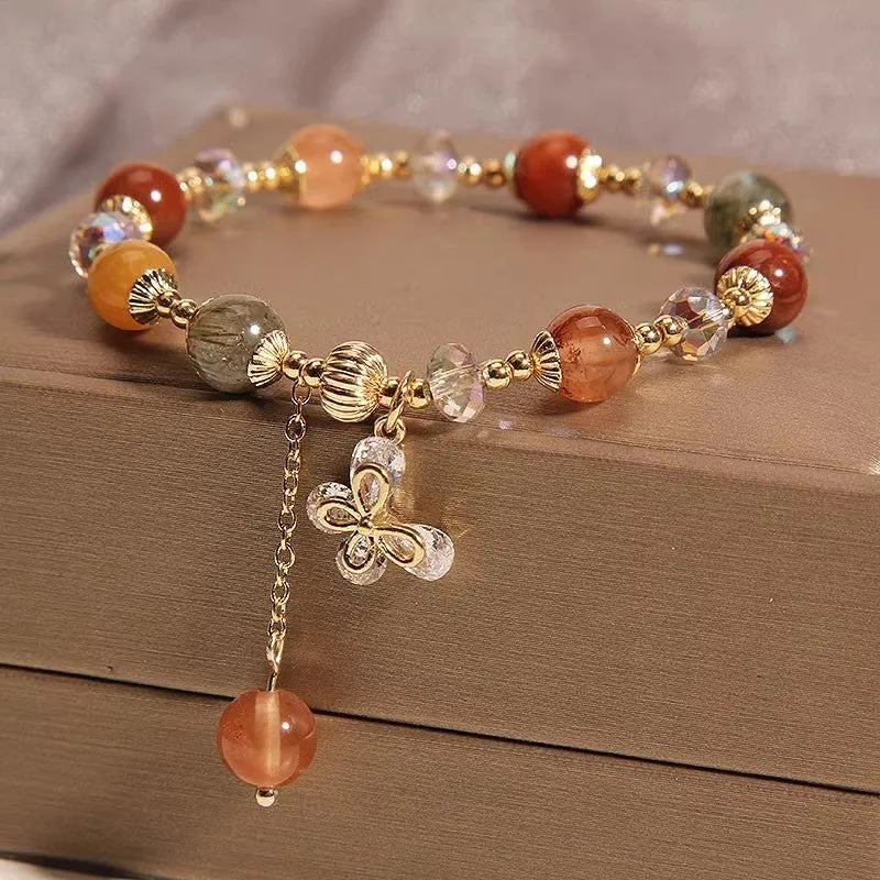 Coloured hair crystal bracelet with cat's paw and butterfly charms in Korean unisex style