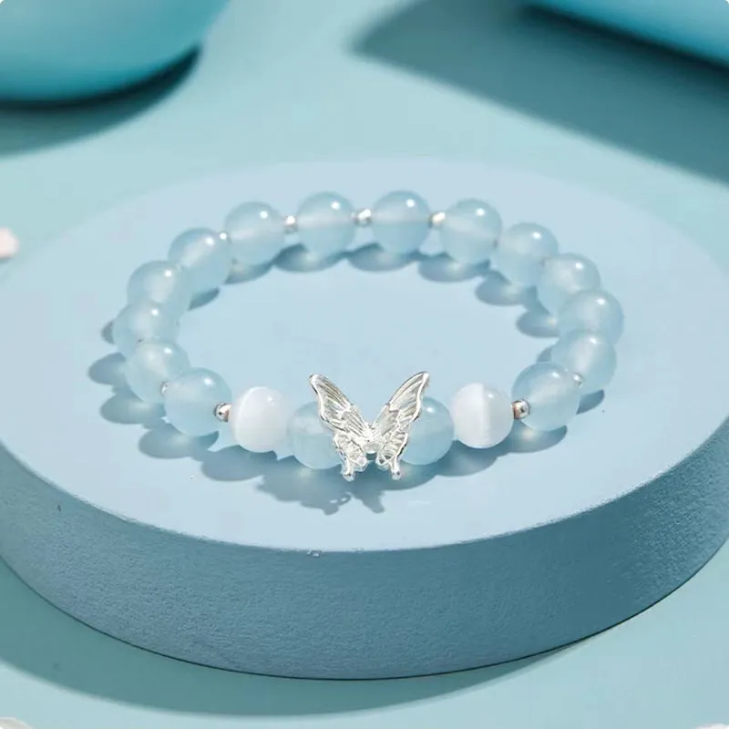Cat eye crystal bracelet for women, bow shape, pink crystal option, on white background
