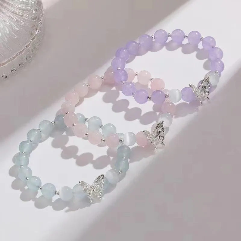 Cat eye crystal bracelet for women, bow shape, pink crystal option, on white background