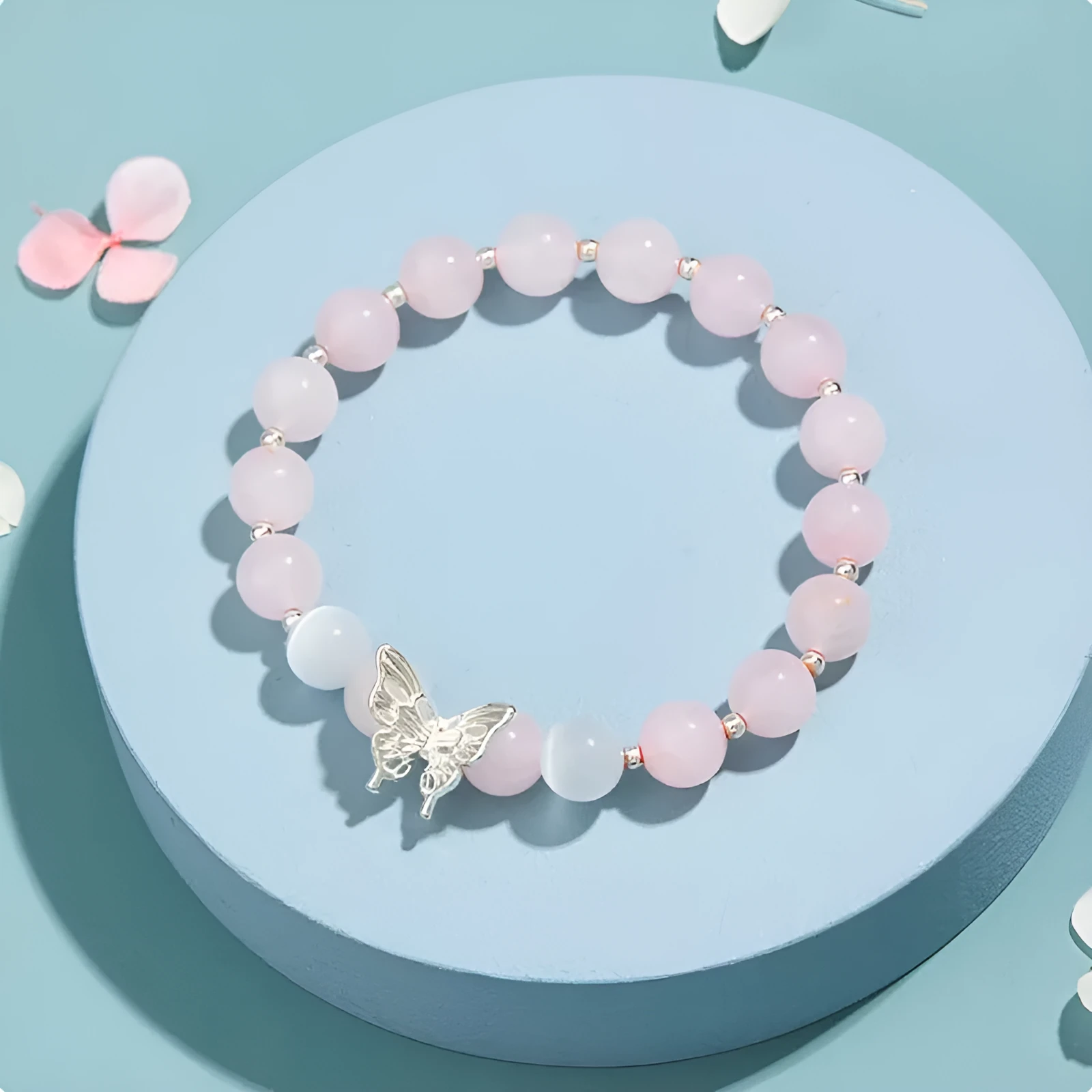 Cat eye crystal bracelet for women, bow shape, pink crystal option, on white background