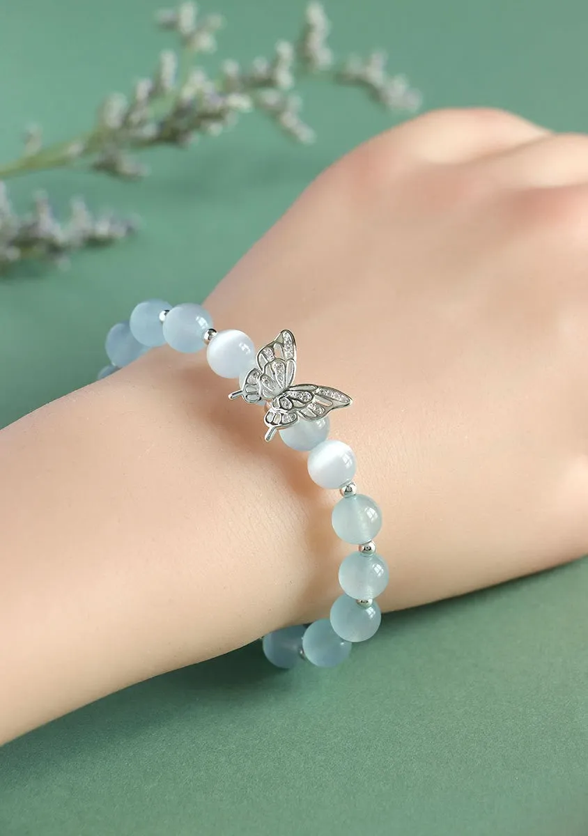 Cat eye crystal bracelet for women, bow shape, pink crystal option, on white background