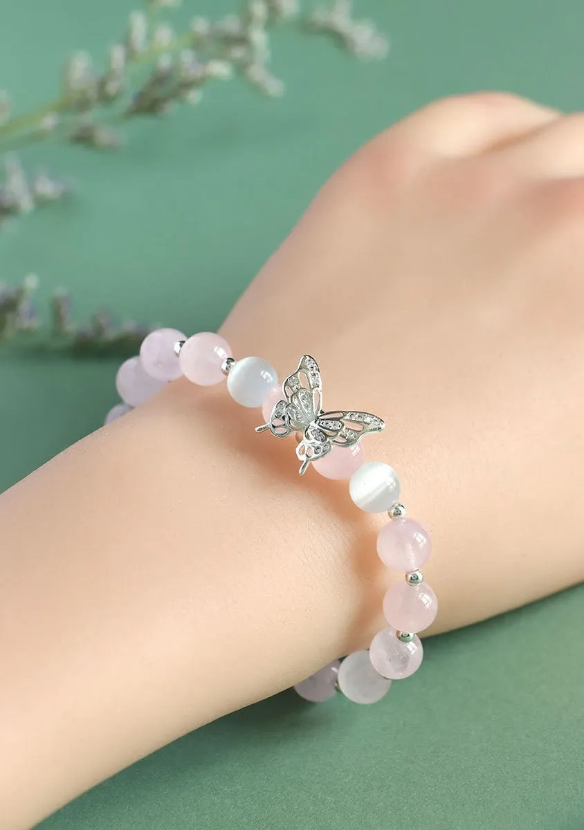 Cat eye crystal bracelet for women, bow shape, pink crystal option, on white background