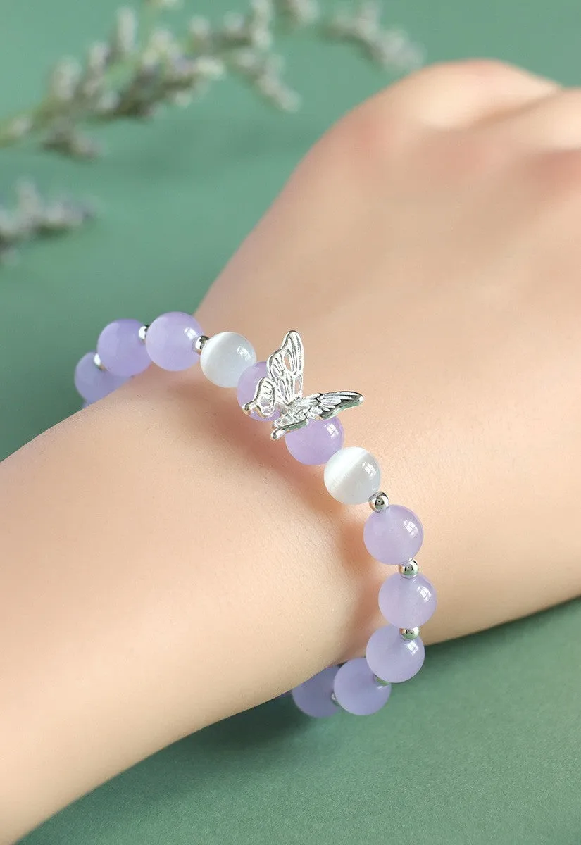 Cat eye crystal bracelet for women, bow shape, pink crystal option, on white background