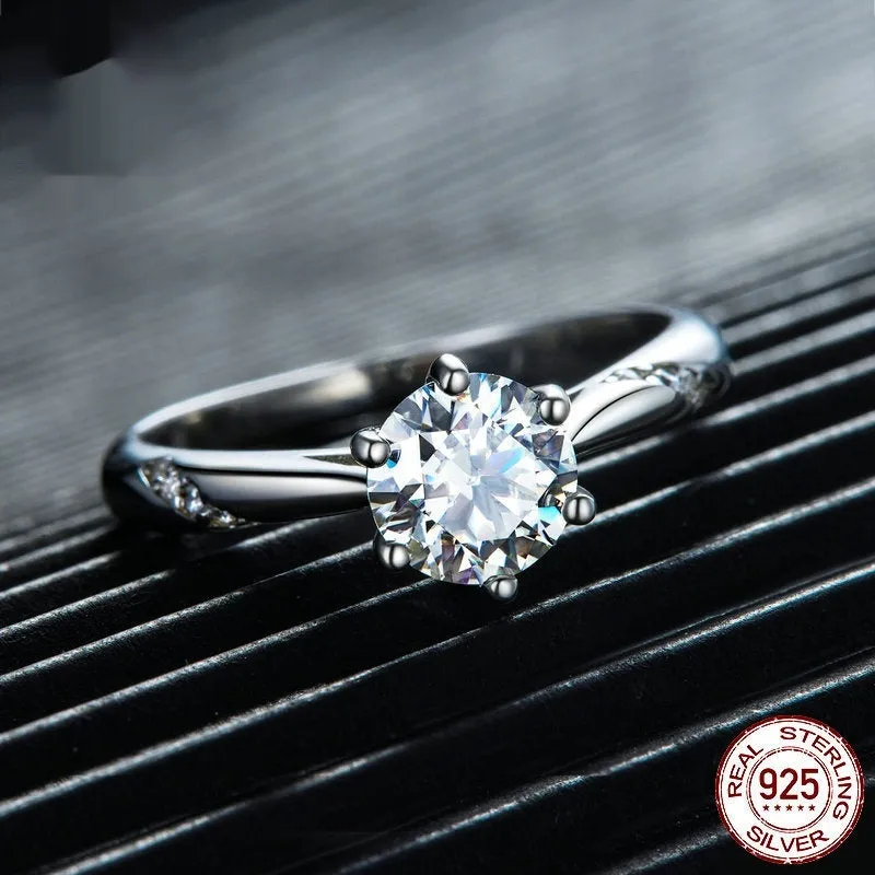 Silver moissanite ring with 1 karat main stone, electroplated finish, size US7 on a white background.