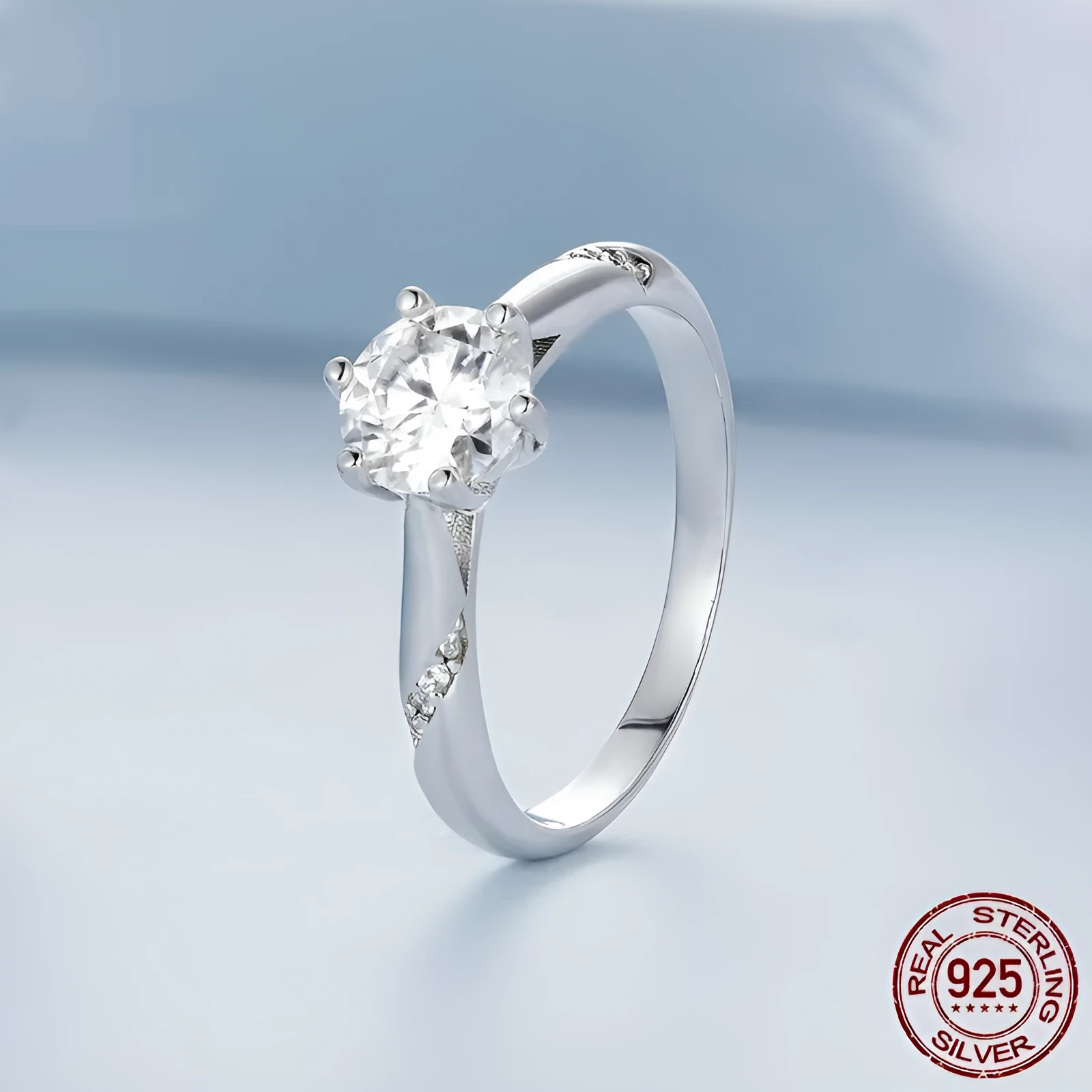 Silver moissanite ring with 1 karat main stone, electroplated finish, size US7 on a white background.