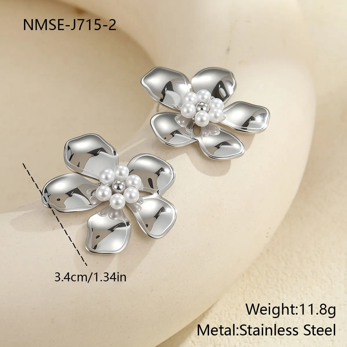 Flower stringed pearls stud earrings in gold and steel colour on white background