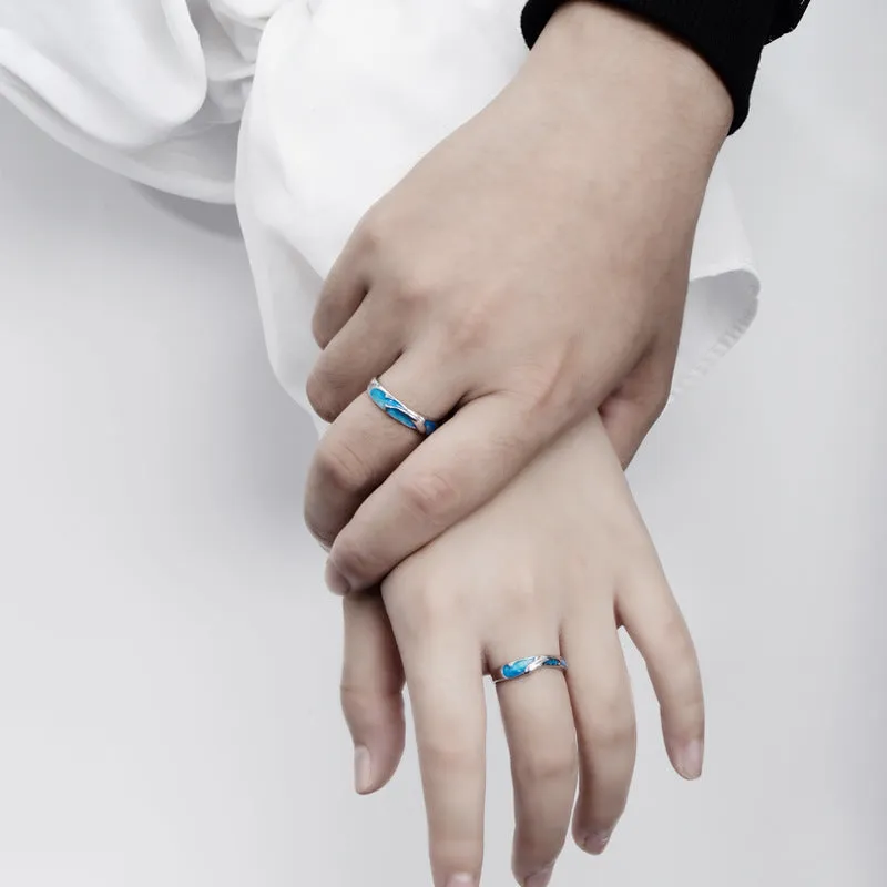 Silver adjustable couple ring with dolphin zodiac motif on white background