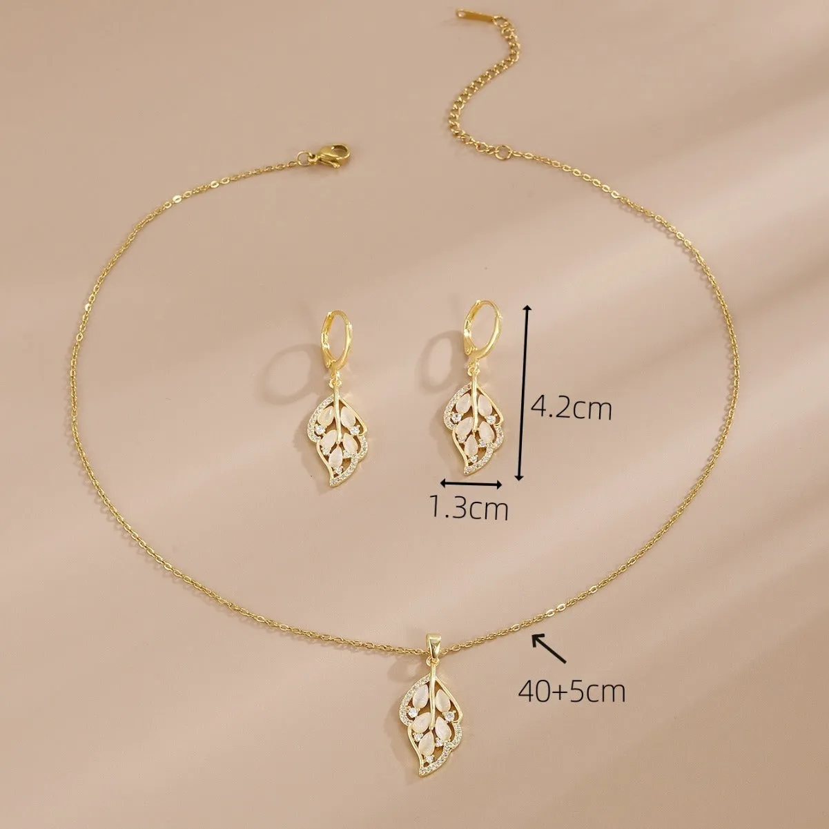 Opal leaves copper electroplated necklace and earrings set on display