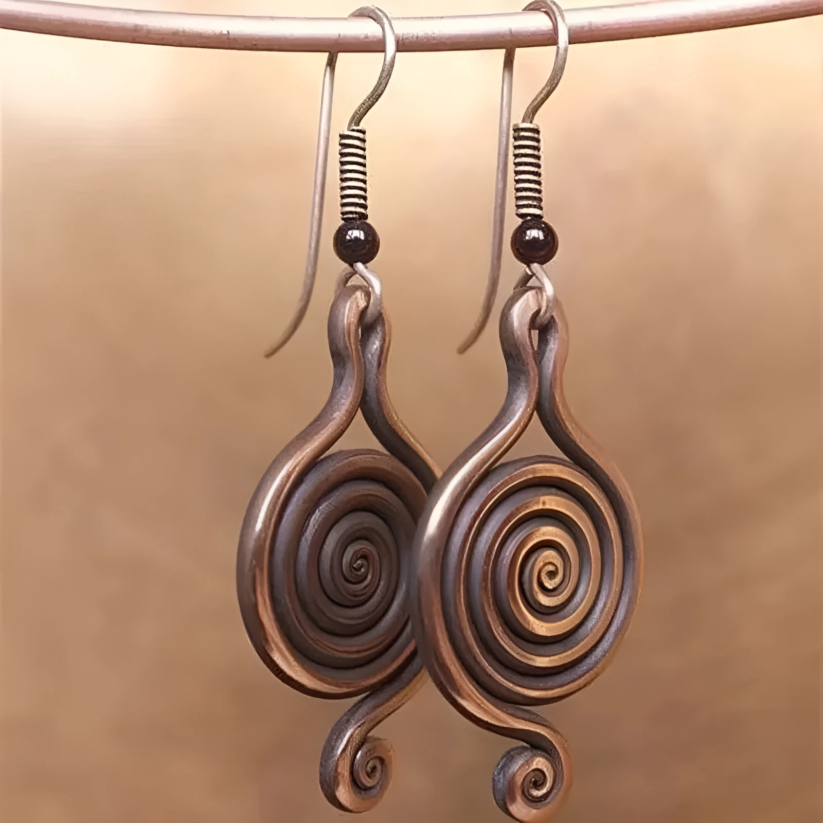 Bronze spiral psychedelic drop earrings with geometric shape and alloy construction