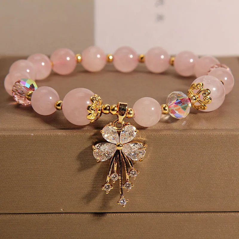 Normcore style crystal bracelet with amethyst and pearl charms on adjustable closure