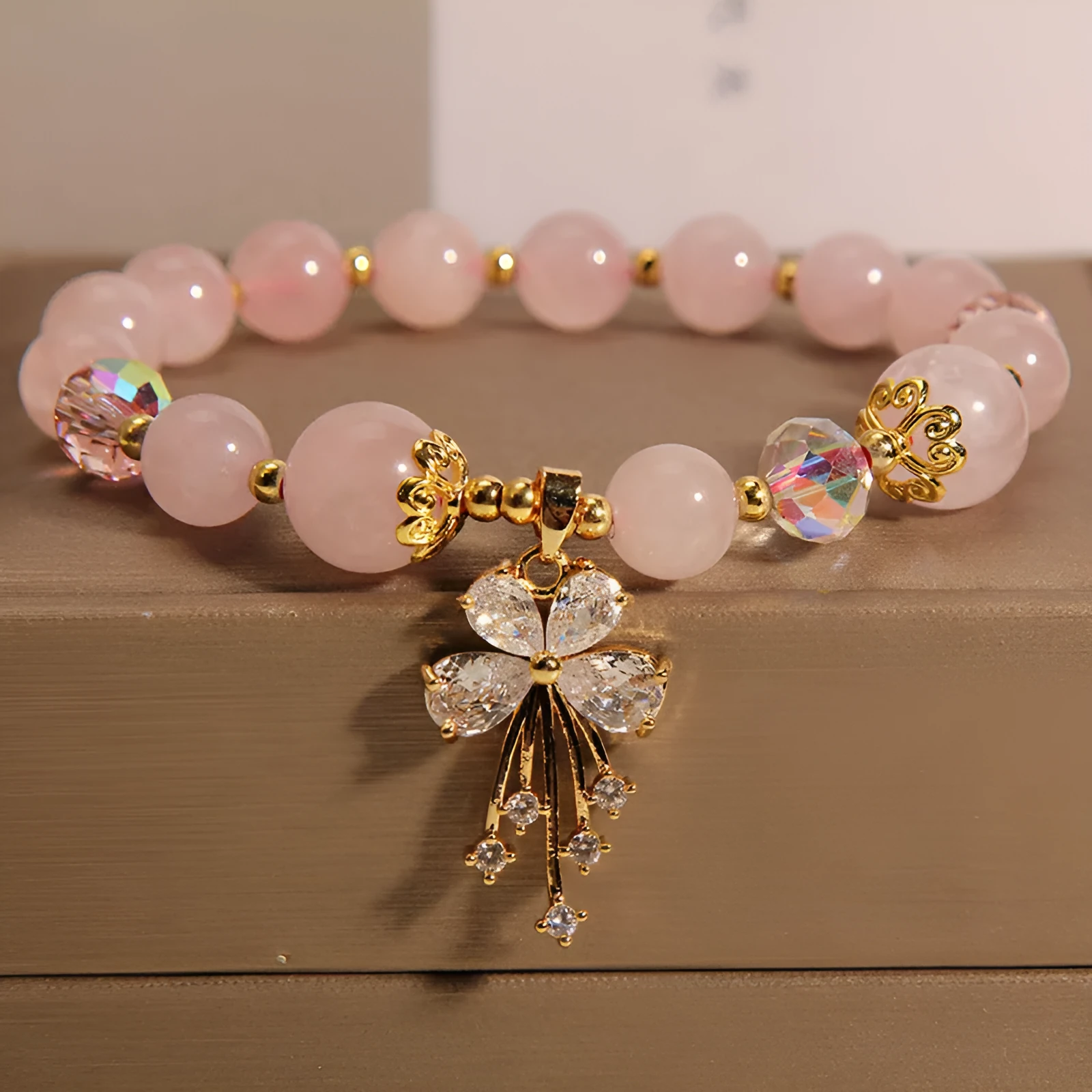 Normcore style crystal bracelet with amethyst and pearl charms on adjustable closure