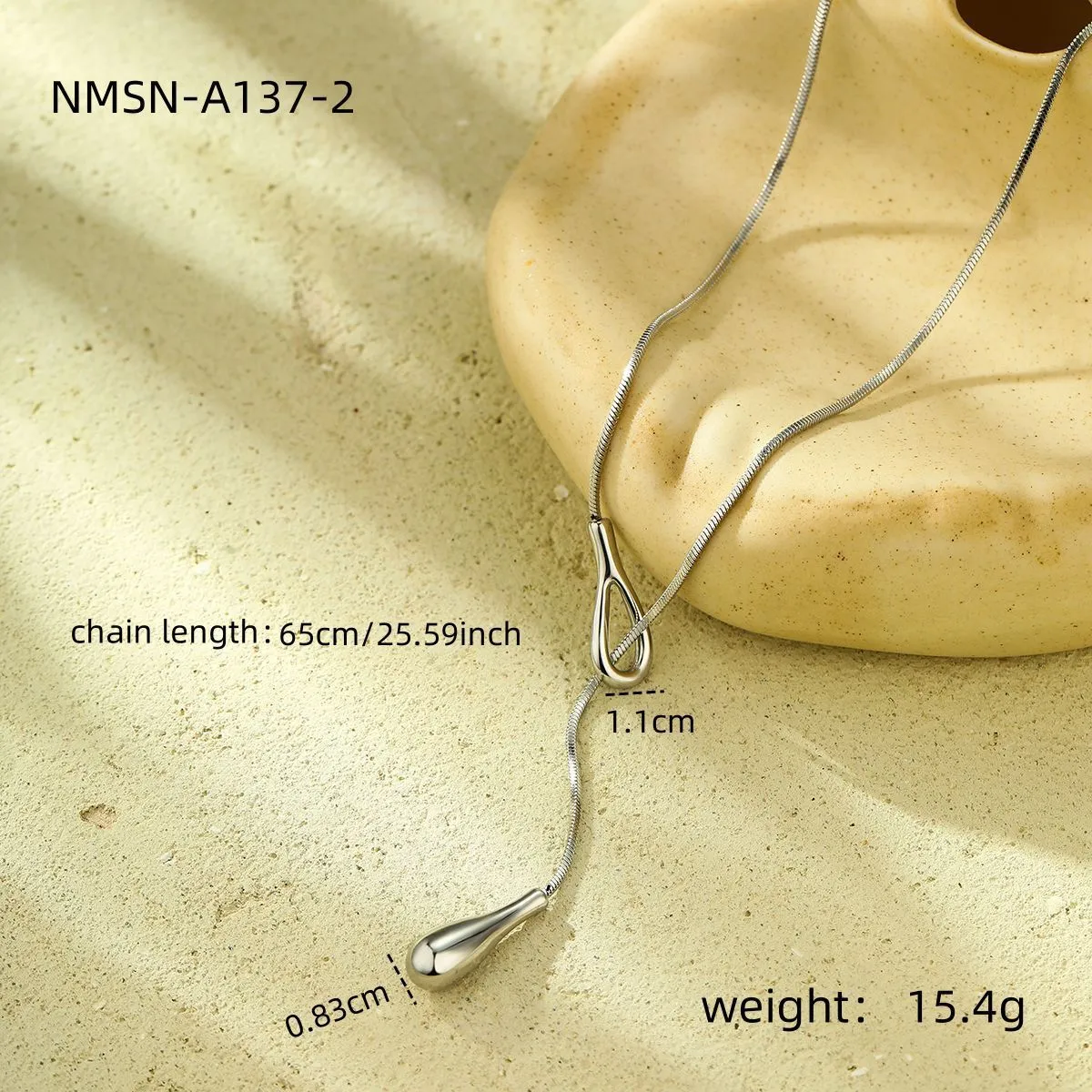 Stainless steel tassel water drop earrings with Y-word chain ornament in 18K gold electroplated finish, geometric drop-shaped design