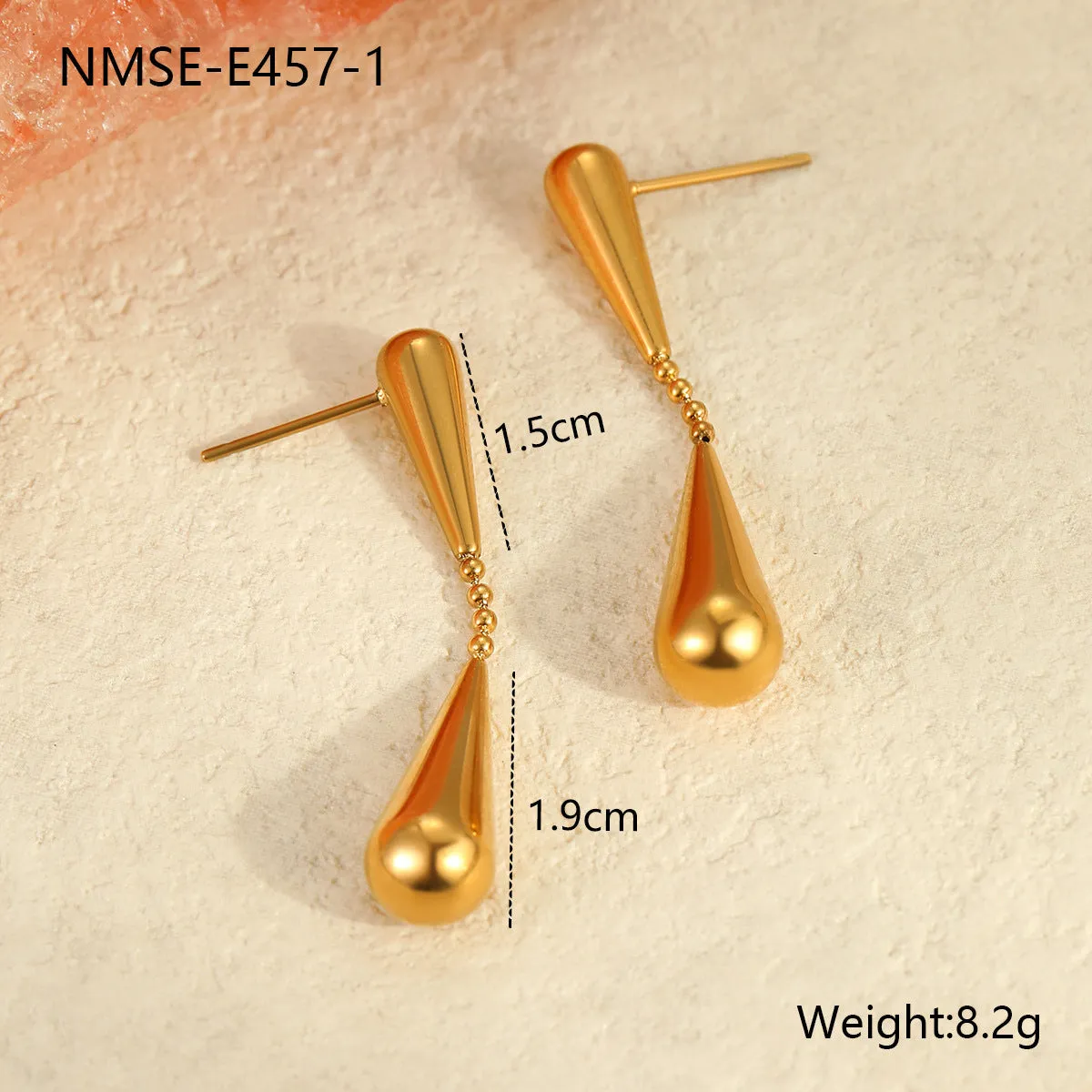 Stainless steel tassel water drop earrings with Y-word chain ornament in 18K gold electroplated finish, geometric drop-shaped design