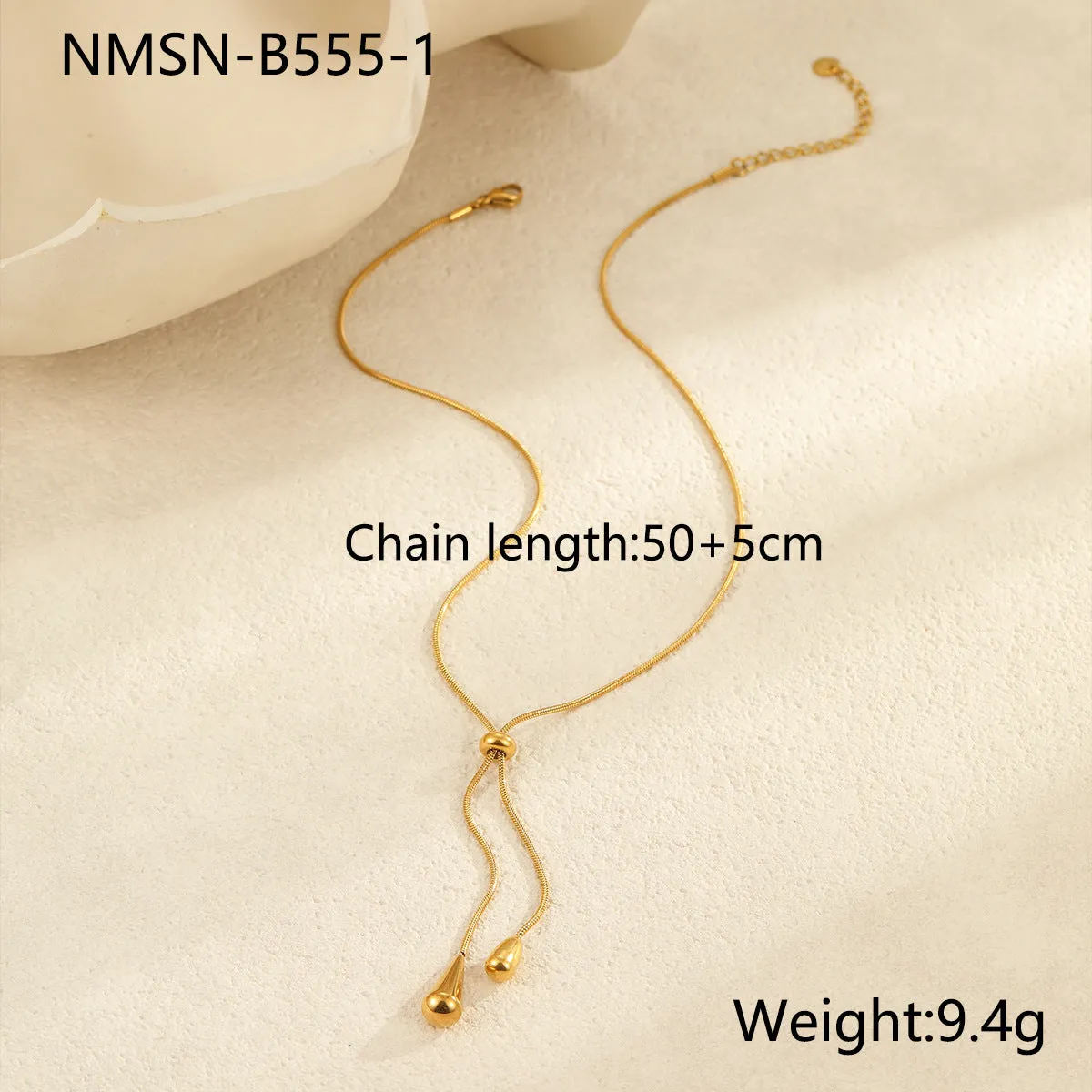 Stainless steel tassel water drop earrings with Y-word chain ornament in 18K gold electroplated finish, geometric drop-shaped design