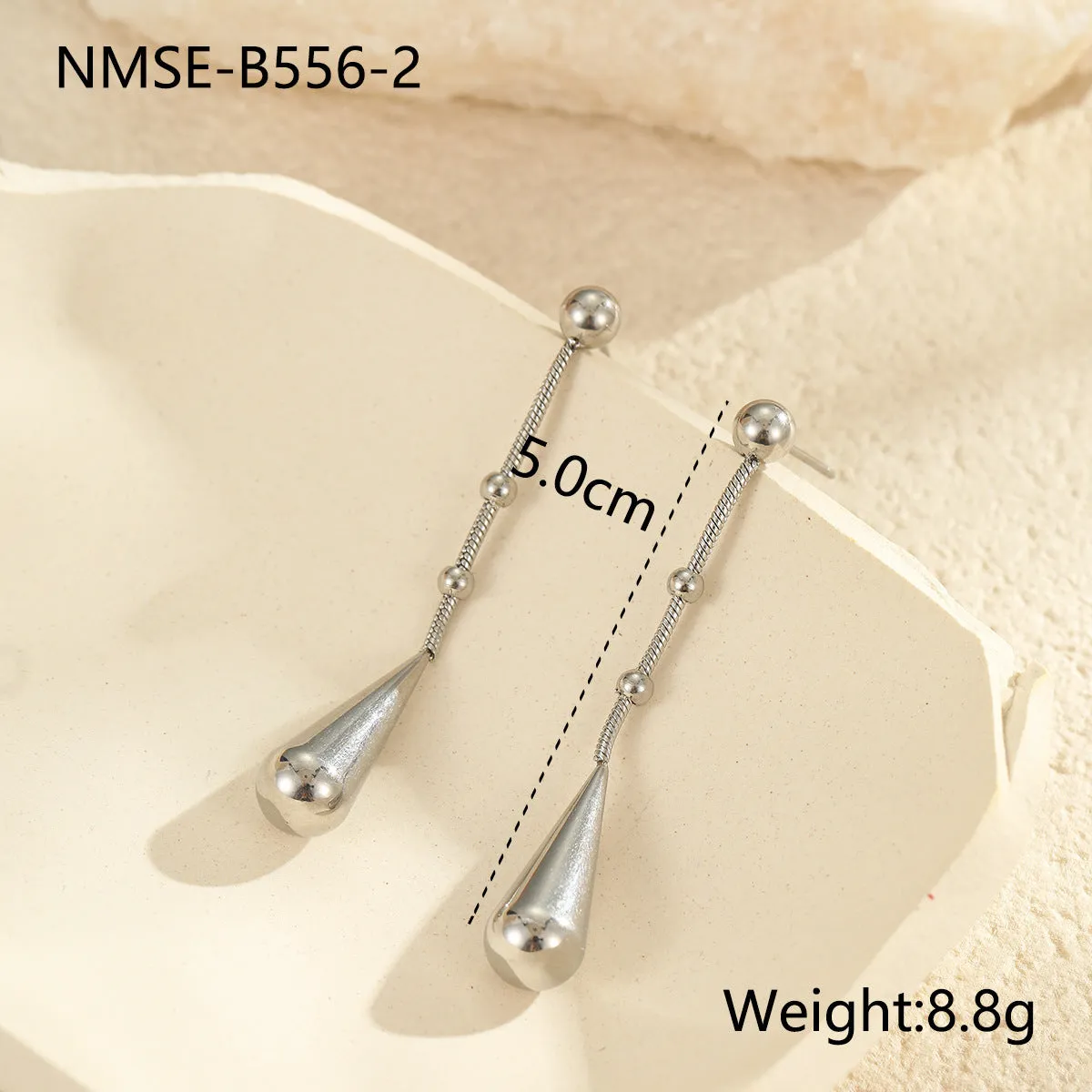 Stainless steel tassel water drop earrings with Y-word chain ornament in 18K gold electroplated finish, geometric drop-shaped design