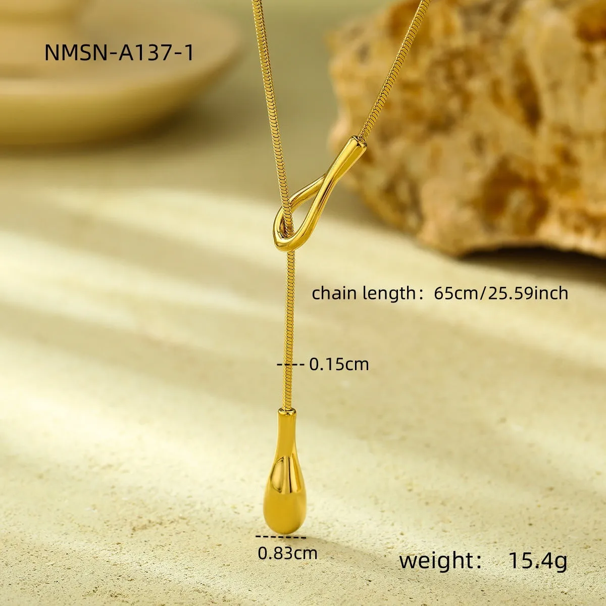 Stainless steel tassel water drop earrings with Y-word chain ornament in 18K gold electroplated finish, geometric drop-shaped design