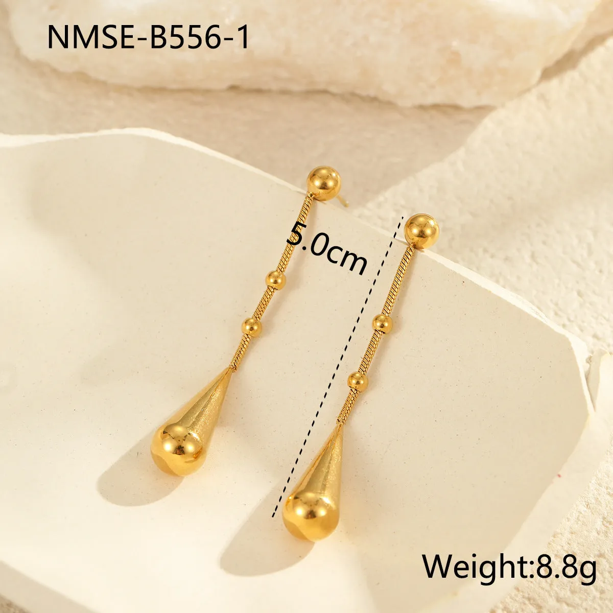 Stainless steel tassel water drop earrings with Y-word chain ornament in 18K gold electroplated finish, geometric drop-shaped design