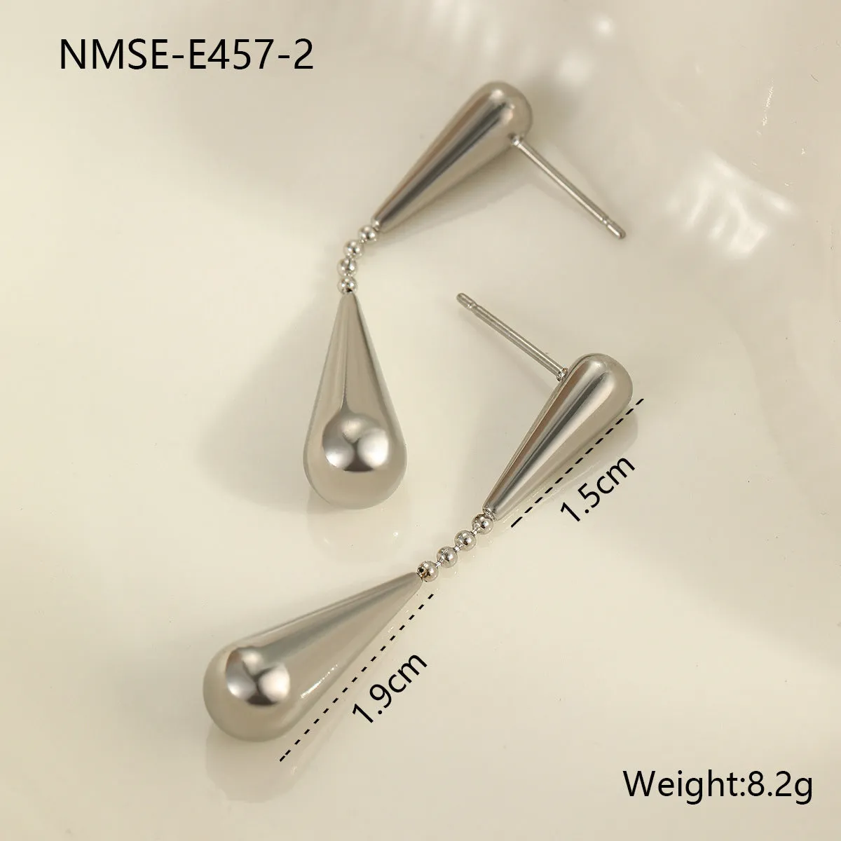 Stainless steel tassel water drop earrings with Y-word chain ornament in 18K gold electroplated finish, geometric drop-shaped design