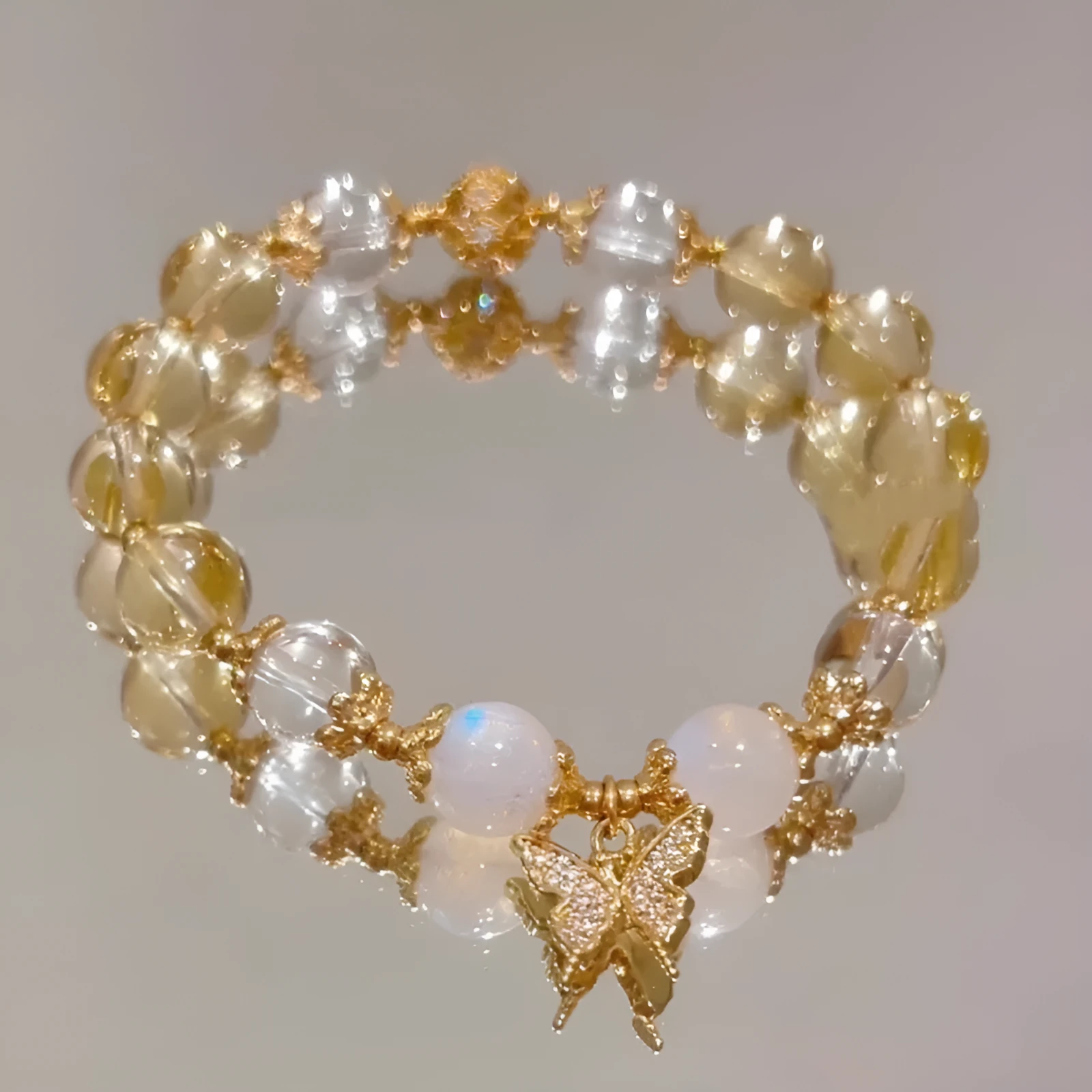 Women's Moonstone White crystal bracelet with diamond-shaped beads and a butterfly charm in Chinese style.