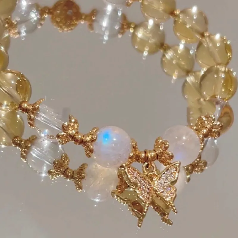Women's Moonstone White crystal bracelet with diamond-shaped beads and a butterfly charm in Chinese style.