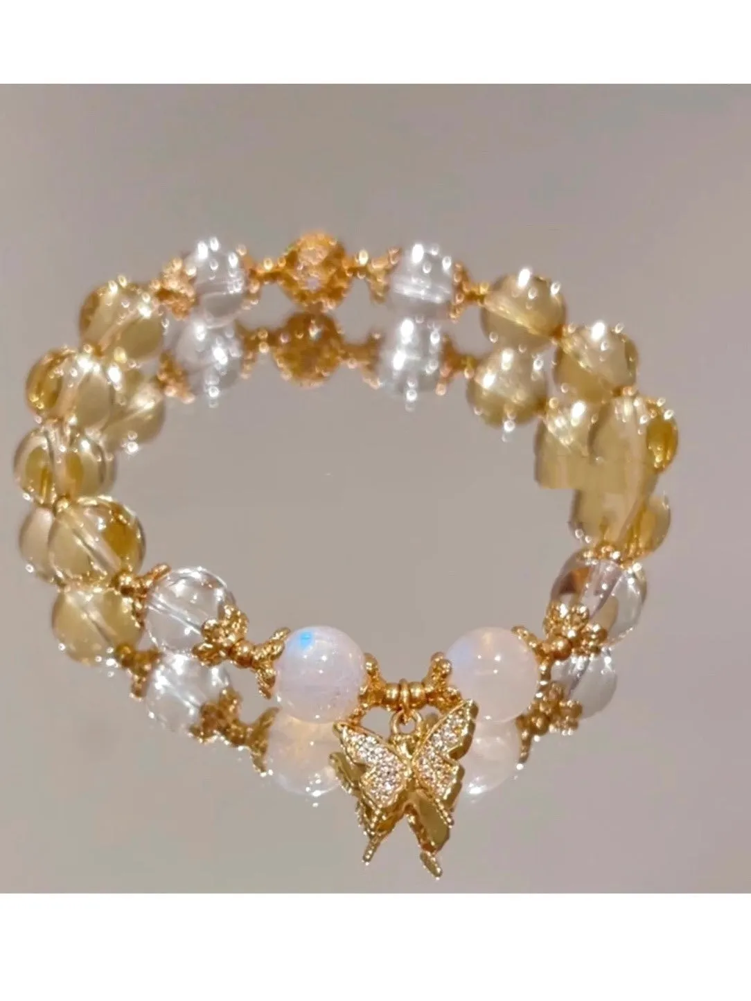 Women's Moonstone White crystal bracelet with diamond-shaped beads and a butterfly charm in Chinese style.