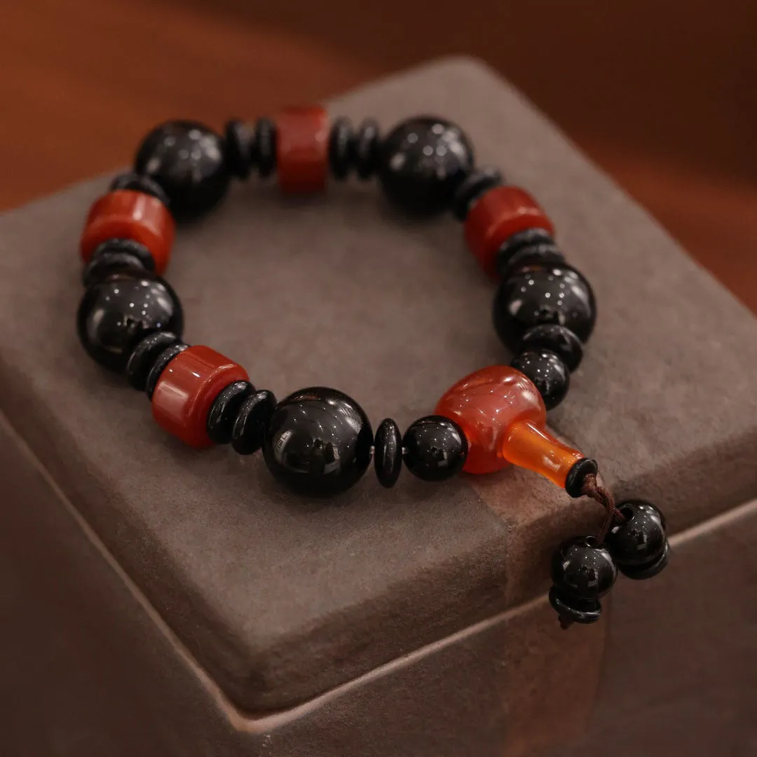 Old agate bracelet with A13 sardonyx bead, white agate spacers, and red agate barrel bead in geometric ethnic design
