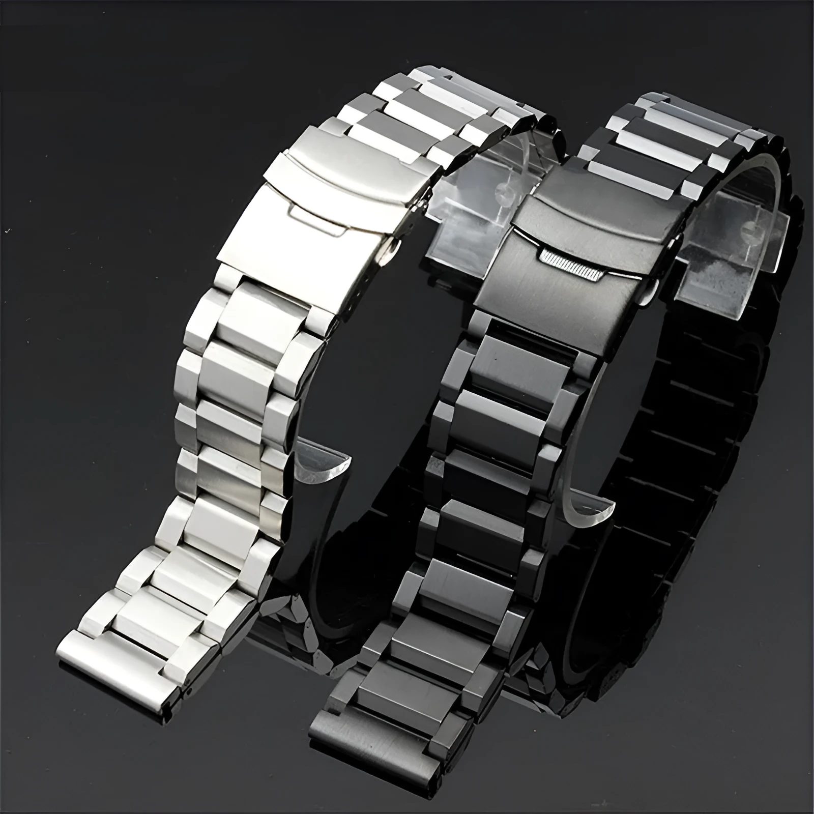 Solid stainless steel watch strap with double-security buckle and quick release pins in silver finish on black background