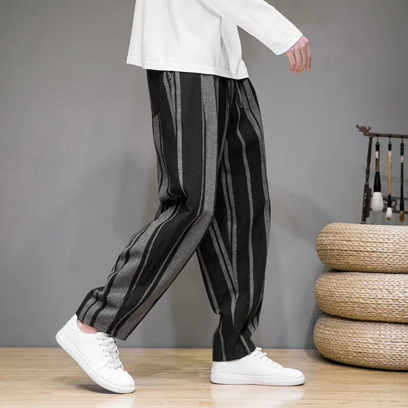 Men's striped casual trousers in black and navy blue options showing mid waist design