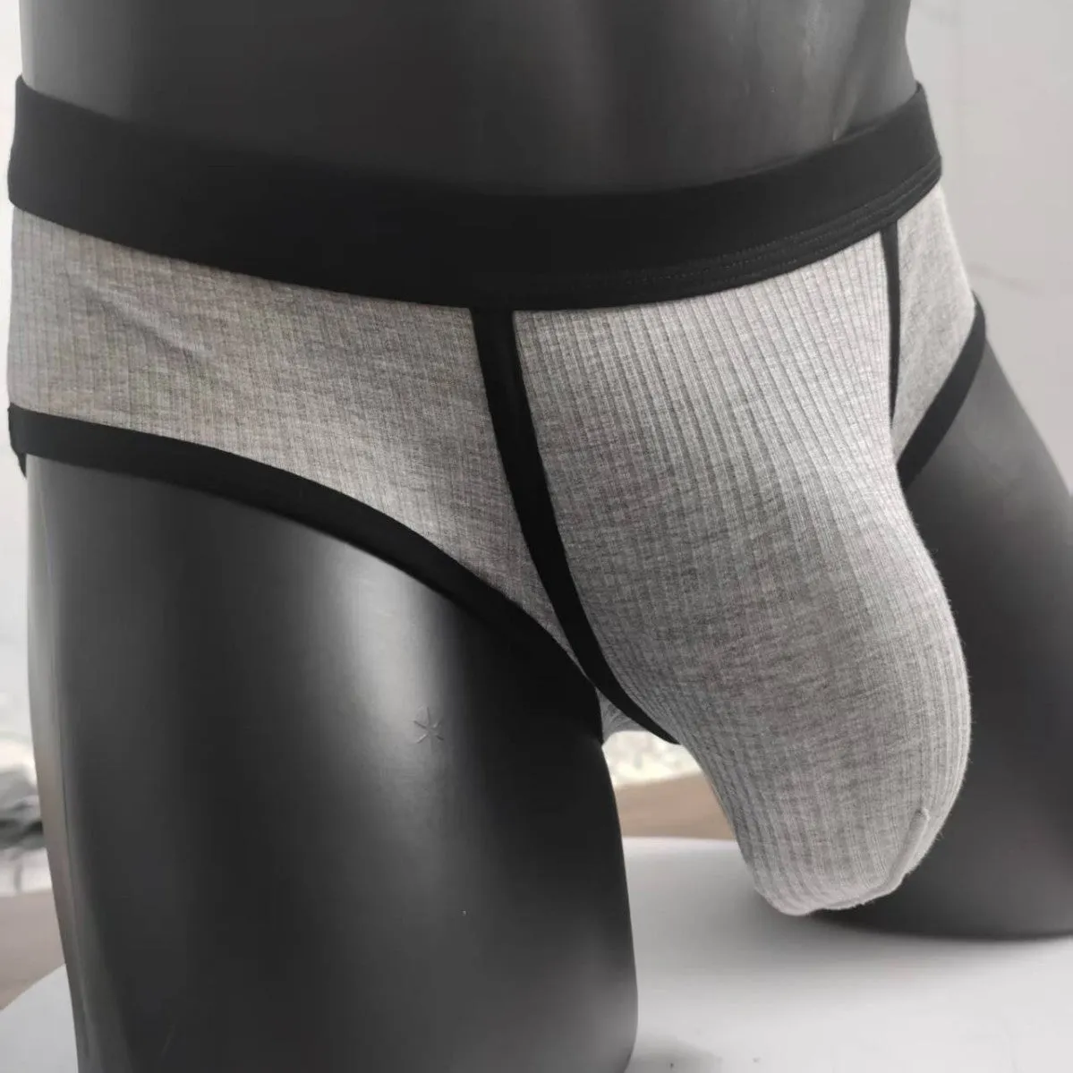 Men's solid colour viscose U-shaped bag briefs on a low waist, shown in multiple colour options.