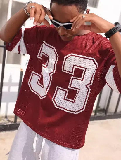 Men's mesh sports jersey in cartoon print with short sleeves and round neck in one of five colour options