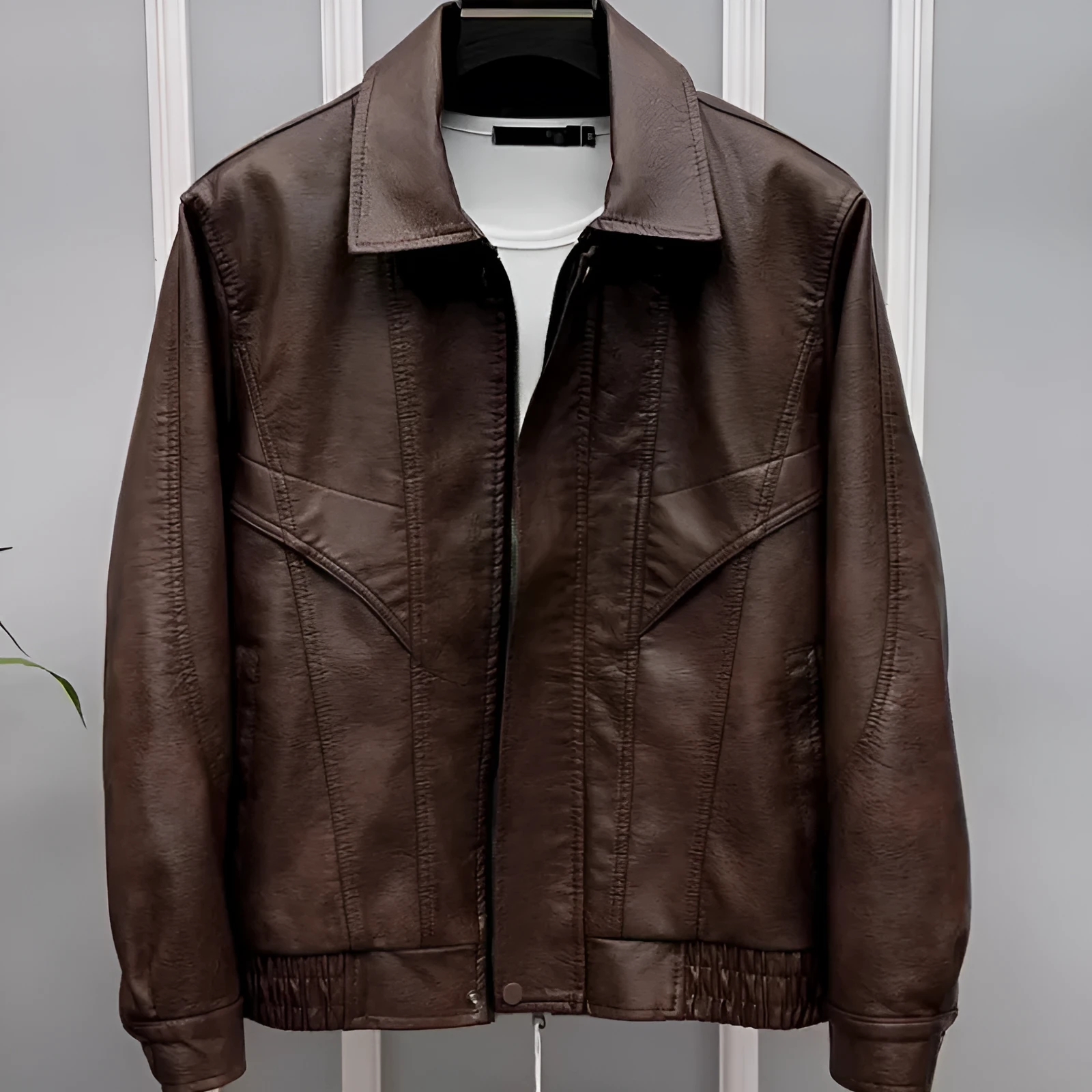 Men's waterproof PU leather lapel jacket in black with loose fit and drawstring sleeves