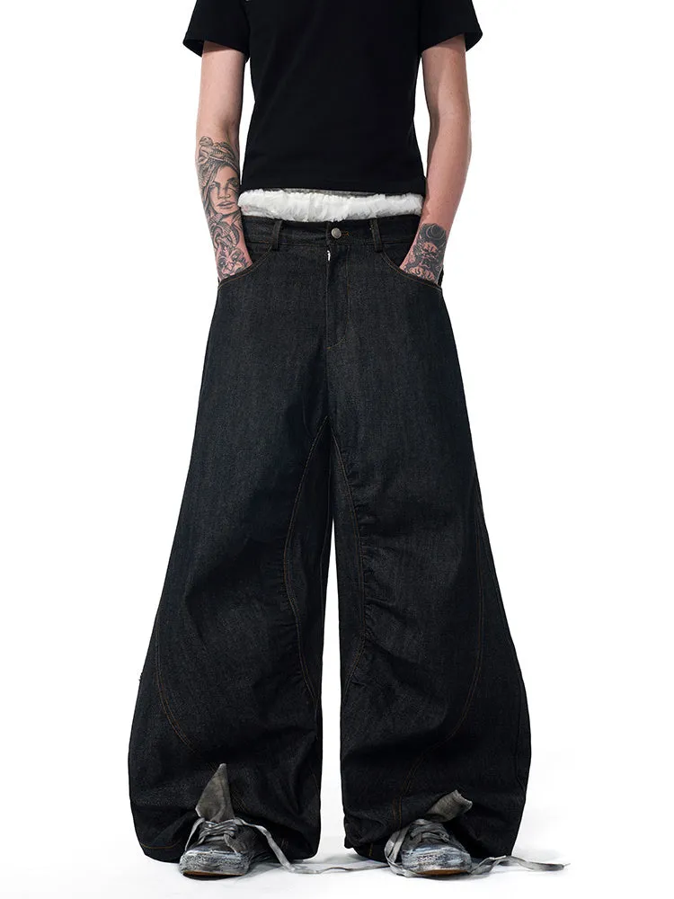 Black wide leg jeans with colour-changing temperature-sensitive embroidery and red ear detailing on a hanger.