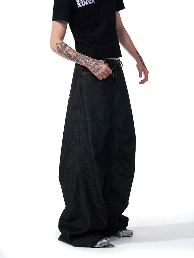 Black wide leg jeans with colour-changing temperature-sensitive embroidery and red ear detailing on a hanger.