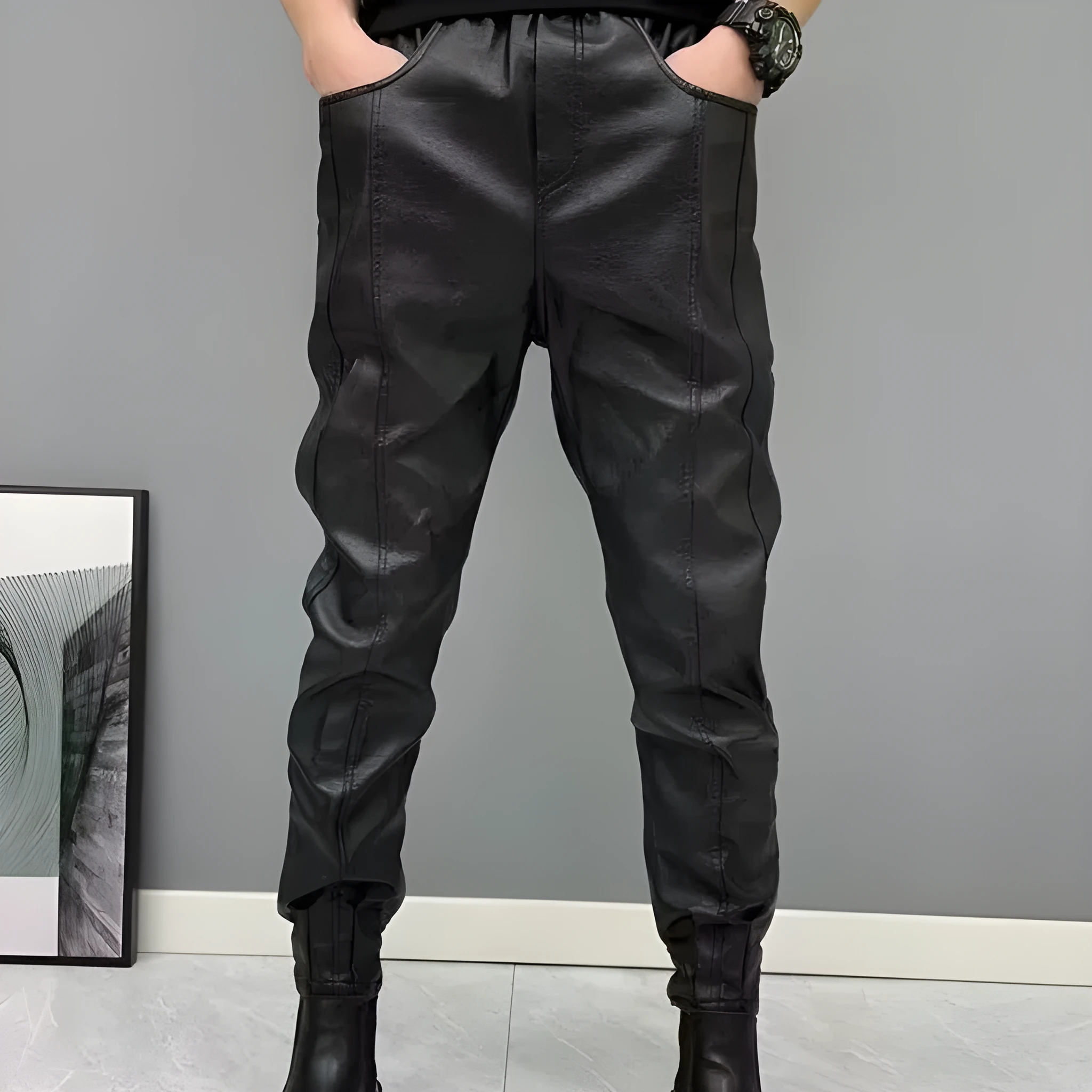 Black PU leather motorcycle takeaway pants with cuffs, tapered leg, and mid-rise waist, on a model