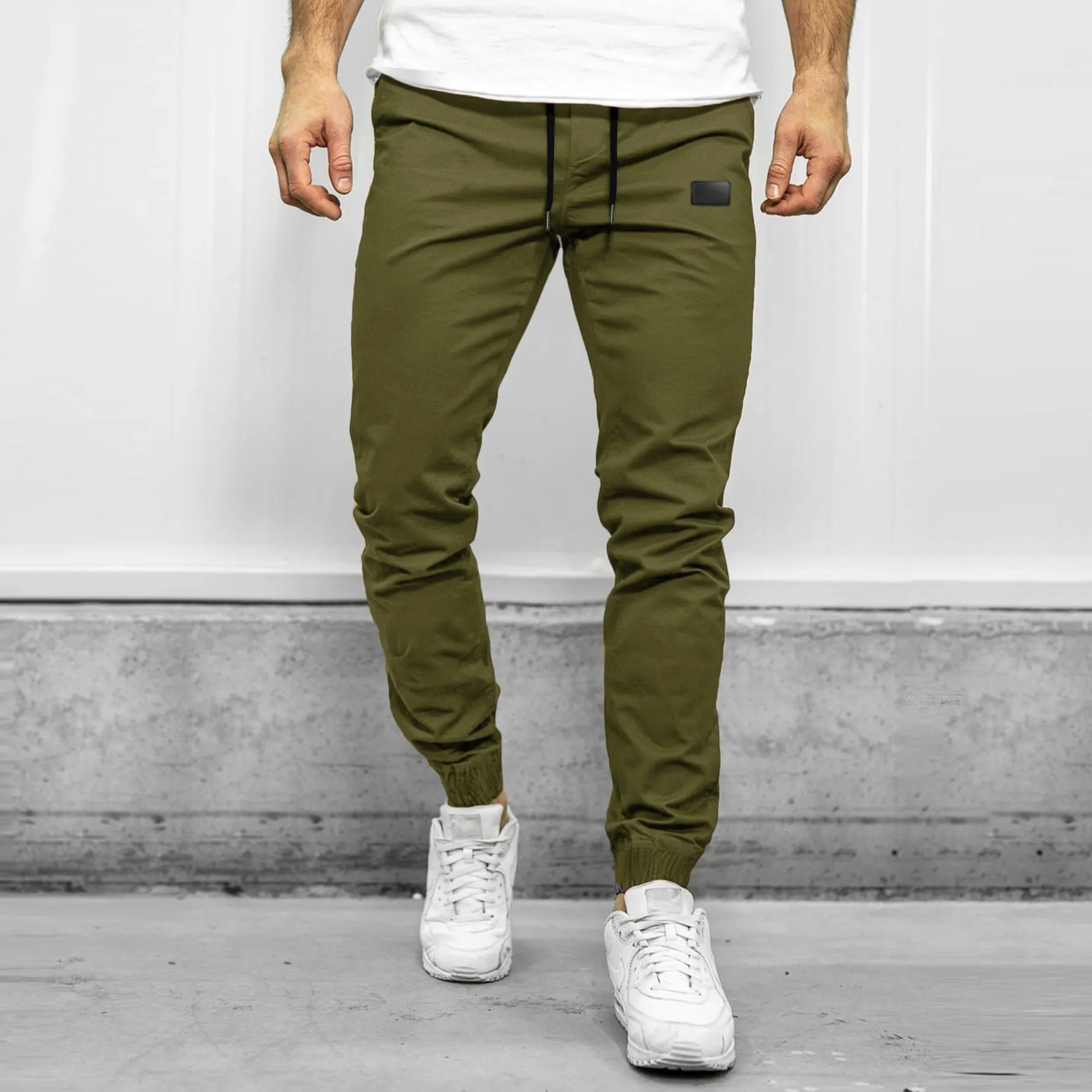 Loose fit quick-dry running trousers in polyester nylon blend, available in four colours and sizes M to XXXL