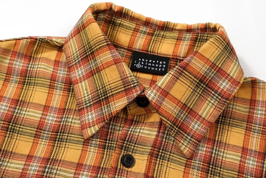 Men's yellow grid plaid short sleeve loose fit shirt on plain background