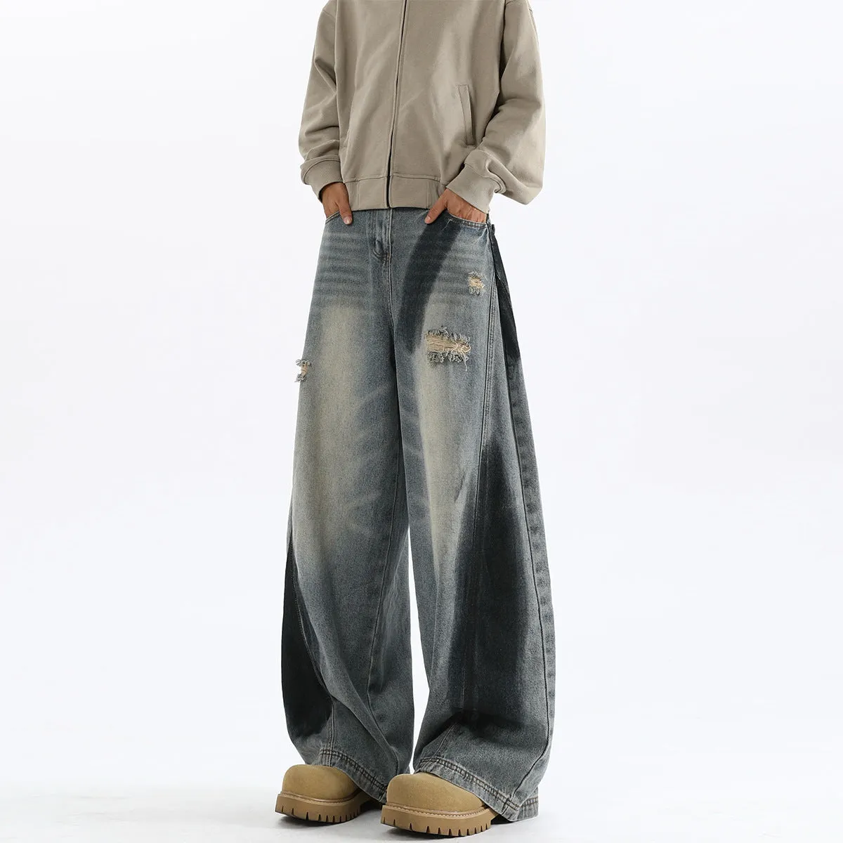 Men's blue distressed jeans with splash-ink patterns and rips in loose fit American style