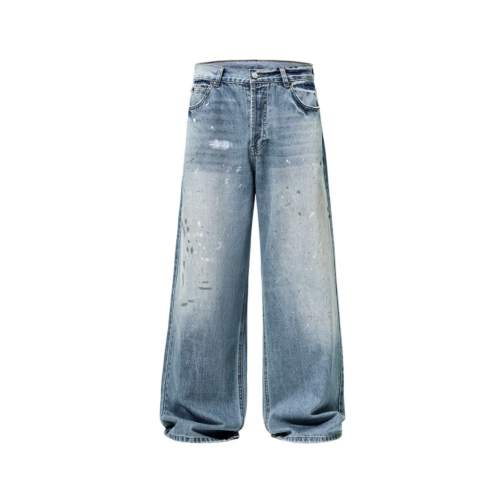 Men's loose fit splash-ink washed denim jeans in Ice Blue on a model, front view